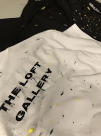 a t - shirt with splatters on it